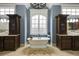 Bathroom features soaking tub, separate vanities with custom cabinets, and designer fixtures at 4820 Marina Ln, Mableton, GA 30126