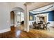 Elegant dining room features hardwood floors, wainscoting, and a modern chandelier at 4820 Marina Ln, Mableton, GA 30126