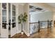 Foyer with hardwood floors, glass paneled office doors, wrought iron banister and coffered ceiling at 4820 Marina Ln, Mableton, GA 30126