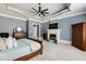 Main bedroom featuring tray ceiling, fireplace, and ensuite bathroom at 4820 Marina Ln, Mableton, GA 30126