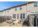 View of home's backyard featuring a wooden fence and patio set at 1530 Redbud Way, Tucker, GA 30083