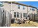 View of home's backyard with seating, fencing and sliding glass door at 1530 Redbud Way, Tucker, GA 30083