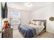 Neutral bedroom with a full-sized bed and window providing natural light at 1530 Redbud Way, Tucker, GA 30083