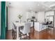 Bright kitchen open to breakfast area features white cabinets and a kitchen island at 1530 Redbud Way, Tucker, GA 30083