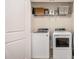 Efficient laundry room with a side-by-side washer and dryer at 1530 Redbud Way, Tucker, GA 30083