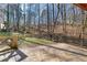 A spacious backyard with a beautiful stone patio, perfect for outdoor relaxation and enjoyment of nature at 2070 Sweetgum Trl, Cumming, GA 30041