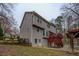 View of back exterior featuring wood siding, deck, fenced yard, and outdoor space at 2070 Sweetgum Trl, Cumming, GA 30041