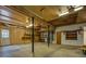 Spacious unfinished basement with wood paneling, a door, and storage space at 2070 Sweetgum Trl, Cumming, GA 30041