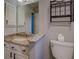 Bathroom featuring granite vanity, sink, and toilet at 2070 Sweetgum Trl, Cumming, GA 30041