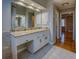 Bathroom vanity with marble countertops and a large mirror at 2070 Sweetgum Trl, Cumming, GA 30041