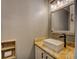 Well-lit bathroom featuring a modern sink and vanity at 2070 Sweetgum Trl, Cumming, GA 30041