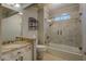 Bathroom featuring a marble countertop vanity and tiled shower/tub combination at 2070 Sweetgum Trl, Cumming, GA 30041