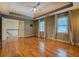 Spacious bedroom with hardwood floors, tray ceiling, and neutral-toned walls at 2070 Sweetgum Trl, Cumming, GA 30041