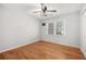 Bedroom features hardwood floors, fan and a window with natural light at 2070 Sweetgum Trl, Cumming, GA 30041