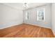 Bright bedroom with wood floors, two windows and a ceiling fan at 2070 Sweetgum Trl, Cumming, GA 30041