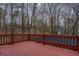 Wooden deck offers a relaxing outdoor space with views of the trees at 2070 Sweetgum Trl, Cumming, GA 30041