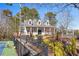 Charming single-Gathering home adjacent to a tennis court, featuring a beautifully landscaped front yard at 2070 Sweetgum Trl, Cumming, GA 30041