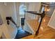 Elegant foyer featuring staircase with hardwood flooring and modern chandelier at 2070 Sweetgum Trl, Cumming, GA 30041