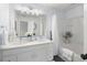 Well-lit bathroom featuring a double sink vanity, tub with shower, and modern fixtures at 217 Enterprise Path, Hiram, GA 30141