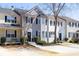 Shot of the exterior of the townhouse with neatly landscaped front yard at 217 Enterprise Path, Hiram, GA 30141