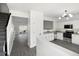 This kitchen features stainless steel appliances, granite countertops and white cabinetry at 217 Enterprise Path, Hiram, GA 30141