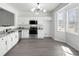 Bright kitchen with stainless steel appliances, gray countertop and a large window at 217 Enterprise Path, Hiram, GA 30141