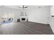 Bright living room with luxury vinyl flooring, a fireplace, and a sliding glass door at 217 Enterprise Path, Hiram, GA 30141