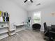 Bedroom with an adjustable-height desk, comfortable seating, and natural light from a window at 2296 Whiteoak Se Dr, Smyrna, GA 30080