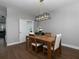 Dining room with hardwood floors and stylish modern lighting fixture at 2296 Whiteoak Se Dr, Smyrna, GA 30080
