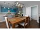 Dining room showcasing an open floor plan with access to kitchen, bar seating, and nearby powder room at 2296 Whiteoak Se Dr, Smyrna, GA 30080