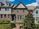 Charming brick townhome with well-maintained landscaping and inviting curb appeal at 2296 Whiteoak Se Dr, Smyrna, GA 30080