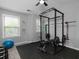 Home gym featuring weightlifting equipment, rubber flooring, and a ceiling fan at 2296 Whiteoak Se Dr, Smyrna, GA 30080