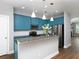 Stylish kitchen with stainless steel appliances, granite countertops, and modern light fixtures at 2296 Whiteoak Se Dr, Smyrna, GA 30080