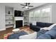 Cozy living room boasts a fireplace with built-in shelves and a comfortable sectional sofa at 2296 Whiteoak Se Dr, Smyrna, GA 30080