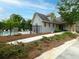 Community pool with surrounding lounge chairs, enclosed by wrought iron fencing and lush landscaping at 2296 Whiteoak Se Dr, Smyrna, GA 30080