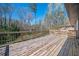 Wood deck with wood railing overlooking the backyard and neighborhood at 2722 Glenbriar Ne Dr, Atlanta, GA 30345
