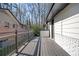 Long deck with painted brick wall, gray railings and access to second story entrance at 2722 Glenbriar Ne Dr, Atlanta, GA 30345