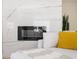 Modern electric fireplace with elegant tile surround, creating a cozy and stylish ambiance at 2722 Glenbriar Ne Dr, Atlanta, GA 30345