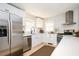 Bright kitchen features stainless steel appliances, sleek white cabinets, and updated fixtures at 2722 Glenbriar Ne Dr, Atlanta, GA 30345
