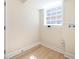 Utility room with wood-look flooring, a window, and hookups for a washer and dryer at 2722 Glenbriar Ne Dr, Atlanta, GA 30345