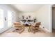 Cozy living room featuring wicker chairs, hardwood floors, and natural light at 2722 Glenbriar Ne Dr, Atlanta, GA 30345