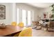 Comfortable living room with wicker chairs, hardwood floors, with access to dining room at 2722 Glenbriar Ne Dr, Atlanta, GA 30345