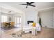 Open living space with decorative fireplace, hardwood floors, and an eat-in kitchen with modern features at 2722 Glenbriar Ne Dr, Atlanta, GA 30345