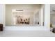 Bright, open-concept living room view with stylish decor and a pass-through to kitchen at 2722 Glenbriar Ne Dr, Atlanta, GA 30345