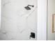 Shower with white marble-style tiling and modern black shower fixture at 2722 Glenbriar Ne Dr, Atlanta, GA 30345