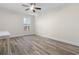 Bedroom featuring hardwood floors, a ceiling fan, natural light, and neutral walls at 7630 Glisten Ave # 304, Atlanta, GA 30328