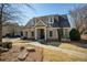 Charming clubhouse featuring dormer windows and a covered entrance, nestled in a landscaped setting at 7630 Glisten Ave # 304, Atlanta, GA 30328