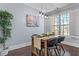 Cozy dining area features a table set for four next to a sunny window at 7630 Glisten Ave # 304, Atlanta, GA 30328