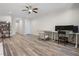 Spacious living room featuring wood floors, ceiling fan, and a minimalist style at 7630 Glisten Ave # 304, Atlanta, GA 30328