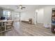 Open living room featuring modern wood floors, a ceiling fan and recessed lighting at 7630 Glisten Ave # 304, Atlanta, GA 30328